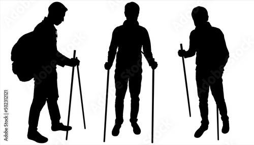 A young guy with a backpack on his back and two walking sticks in his hands. Hiker, tourism. A man on a hike. Male tourists stand together and look down. Three black male silhouettes isolated on white