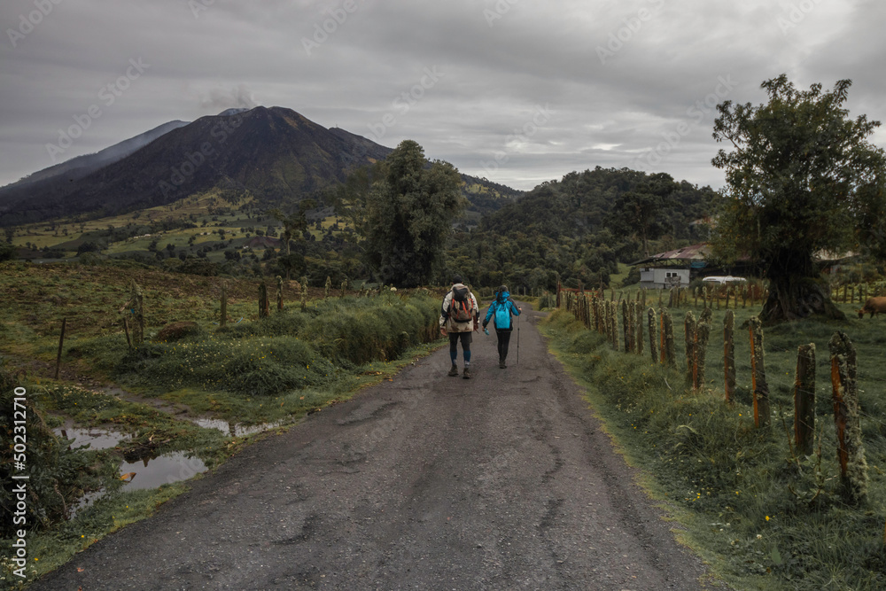 couple of hikers walking in the Turrialba Volcano National Park in Costa Rica