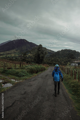 female hiker walking in Turrialba Volcano National Park in Costa Rica