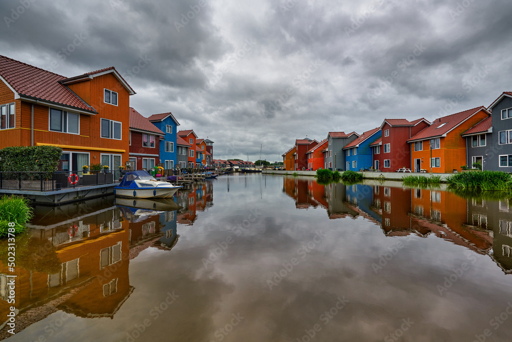 The Netherlands is a charming town of Groningen, a small estate on the plan by a water canal	