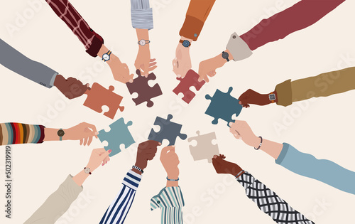 Canvastavla Group of multicultural business people with arms and hands in a circle holding a piece of jigsaw