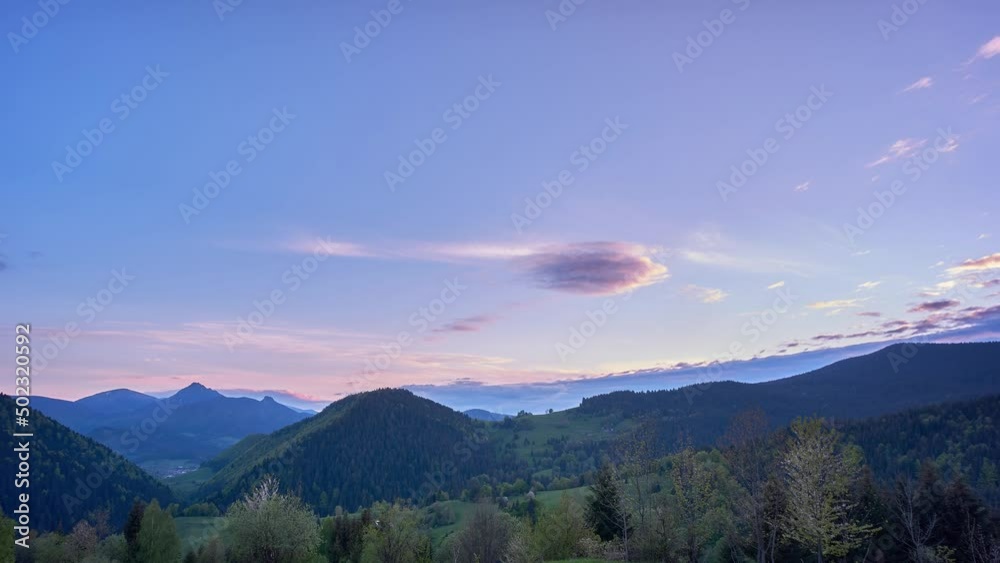 Twilight over beautiful wooded and hilly landscape, Dusk, transition from day to night Twilight over beautiful wooded and hilly landscape, Dusk, transition from day to night