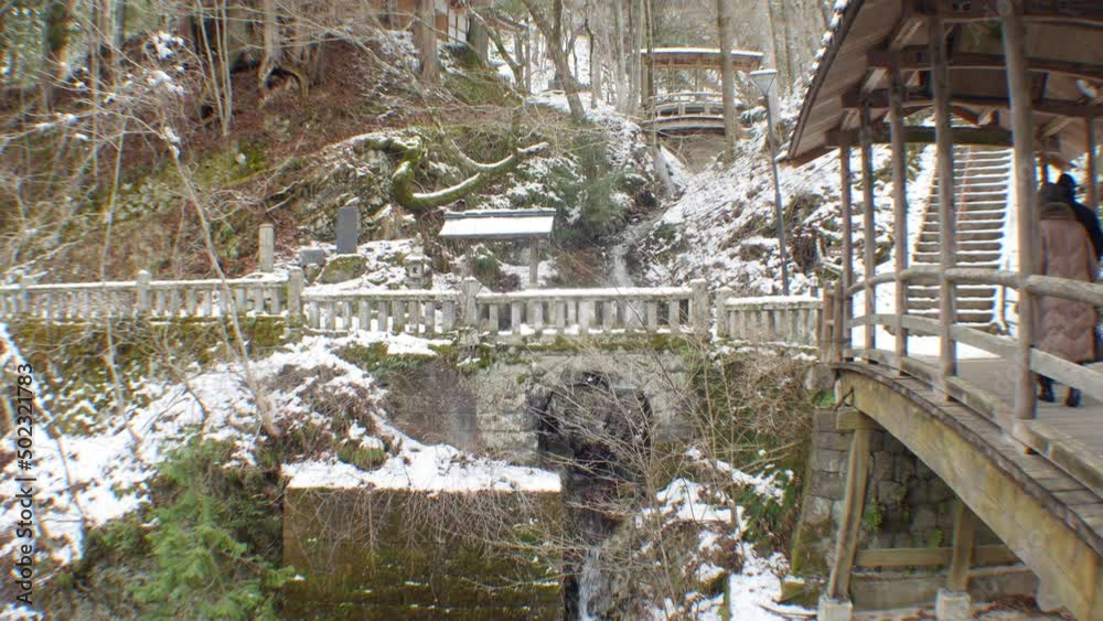 Stone-made bridge in Nagano mountain is covered by snow in Japan Stone-made bridge in Nagano mountain is covered by snow in Japan