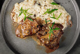 Closeup on mignon steak with risotto garnish