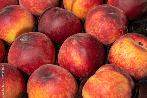 Beautiful red-yellow nectarines in natural light