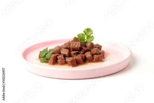 Εκτύπωση καμβά Delicious wet food for a cat or dog, pieces of nutritious meat for an animal, dog or cat in a plate on a white background