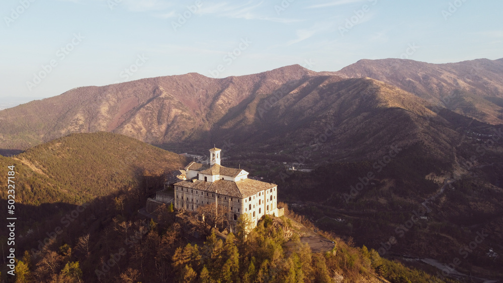 Aerial view of the Sanctuary of Saint Ignatius of Loyola situated in the Lanzo Valleys in Italy. Tourist attraction and famous place of pilgrimage in Province of Turin, Piedmont region. 