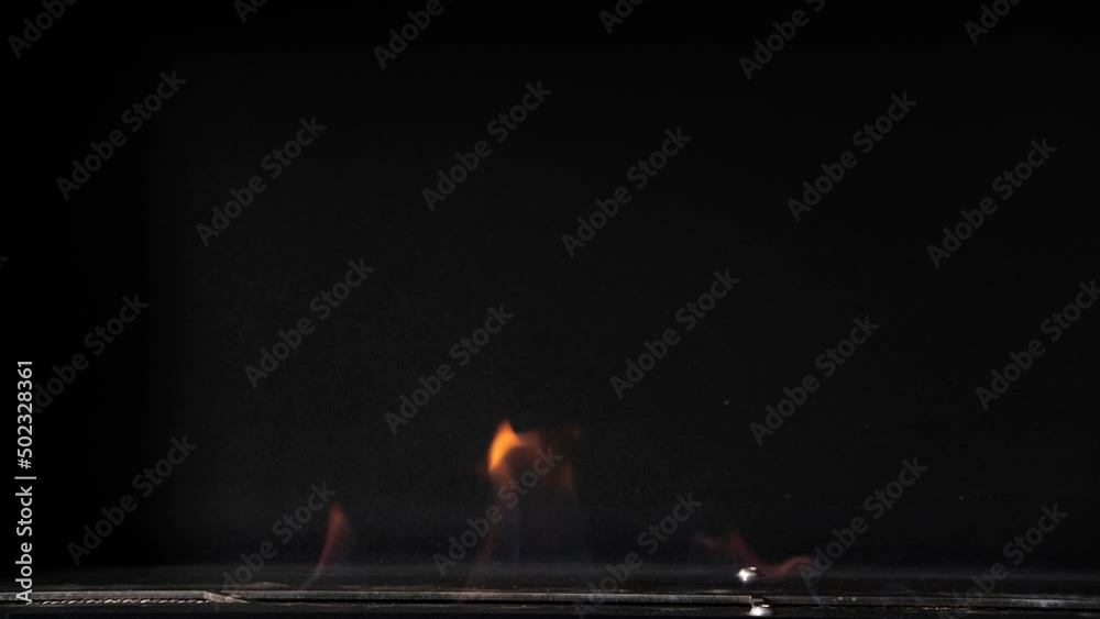 Artificial fireplace burning with fire close-up. Biofuel fireplace burn. Modern smart eco alternative technologies Artificial fireplace burning with fire close-up. Biofuel fireplace burn. Modern smart eco alternative technologies