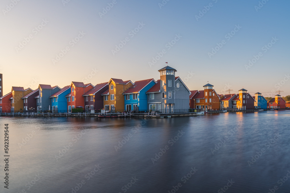 Colorful houses beside the lake at dusk in Groningen, Nehterlands