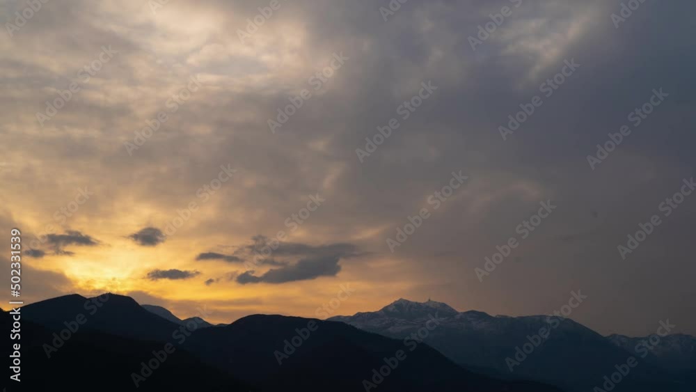 Timelapse of a beautiful sunrise on the tops of the mountains. Sun rays through the clouds Timelapse of a beautiful sunrise on the tops of the mountains. Sun rays through the clouds