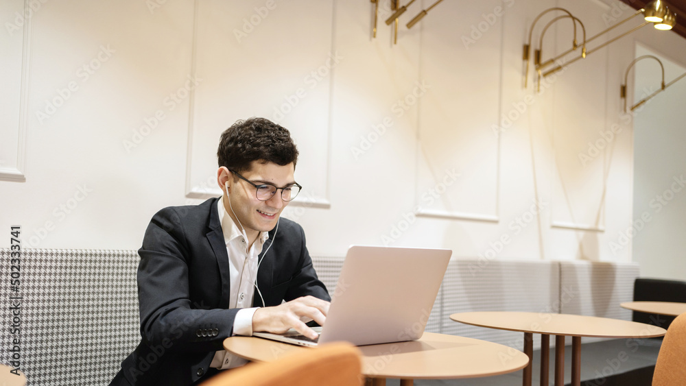 Career manager with glasses work office uses a laptop writes a response to the client. Company report video call Career manager with glasses work office uses a laptop writes a response to the client. Company report video call