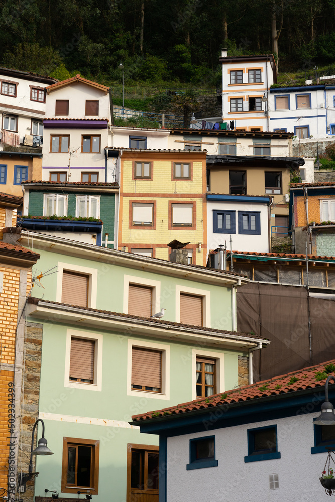 View of the fishing village of Cudillero with the colorful houses at sunset in Asturias, Spain.