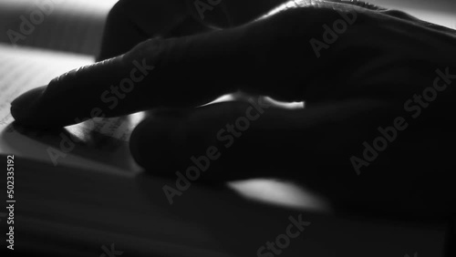 Follow words, turn pages, follow book pages with fingers. Dark room. Alone.