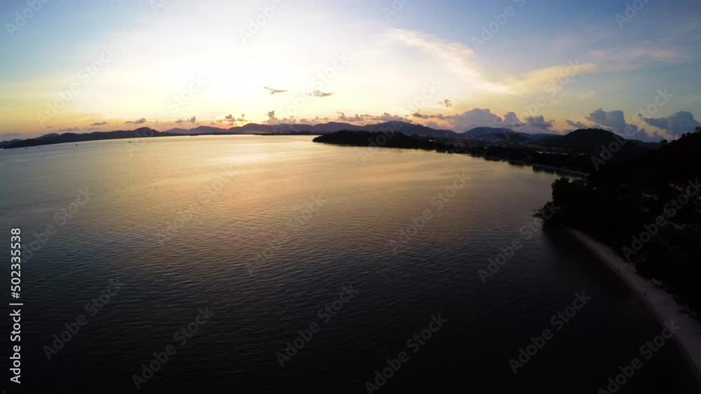 Aerial Scenic Shot Of Mountains Against Cloudy Sky, Drone Flying Forward Over Sea During Sunset - Bangkok, Thailand Aerial Scenic Shot Of Mountains Against Cloudy Sky, Drone Flying Forward Over Sea During Sunset - Bangkok, Thailand