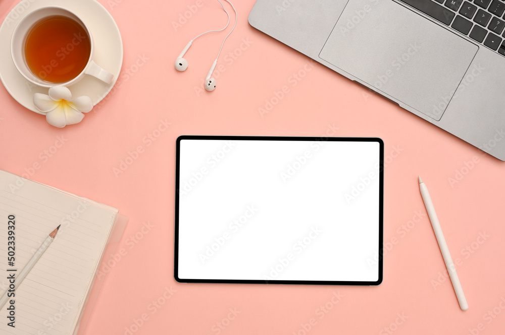 Lovely feminine workspace office desk top view with tablet mockup on pink background. - obrazy, fototapety, plakaty 
