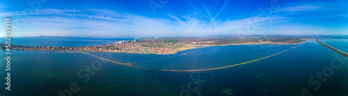 Panoramic view from a height above the town of Pomorie with houses and streets washed by the Black Sea in Bulgaria © YouraPechkin