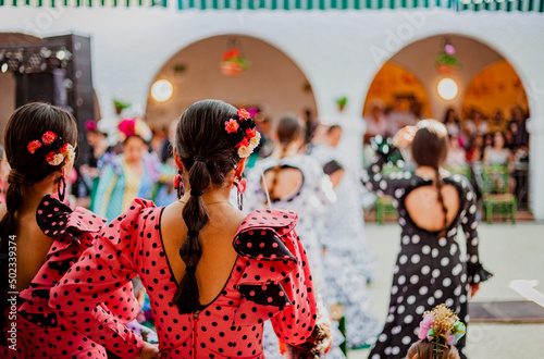 Tela spanish woman dressed as sevillanas at a traditional festival in Rota, Spain
