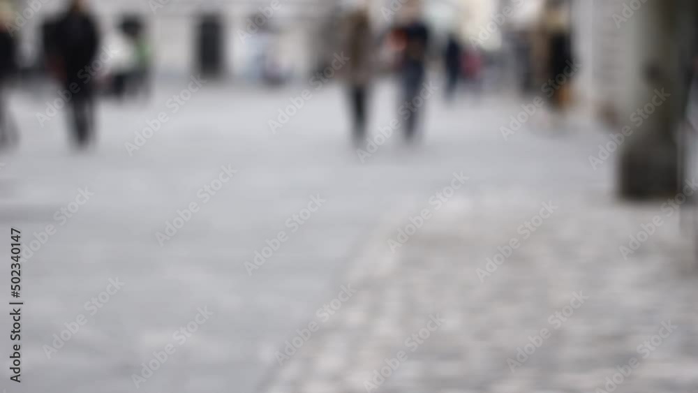 Out of focus, blurred, not recognizable people in town, on streets. Walking. Out of focus, blurred, not recognizable people in town, on streets. Walking.