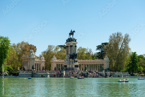 Madrid, Spain - April 16, 2022: Retiro pond, monument to Alfonso XII photo