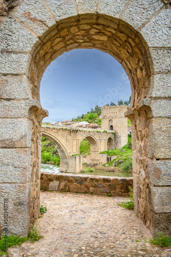 Scenic view of medieval pedestrian San Martin s bridge offering sweeping views of the Tagus River in Toledo  Spain