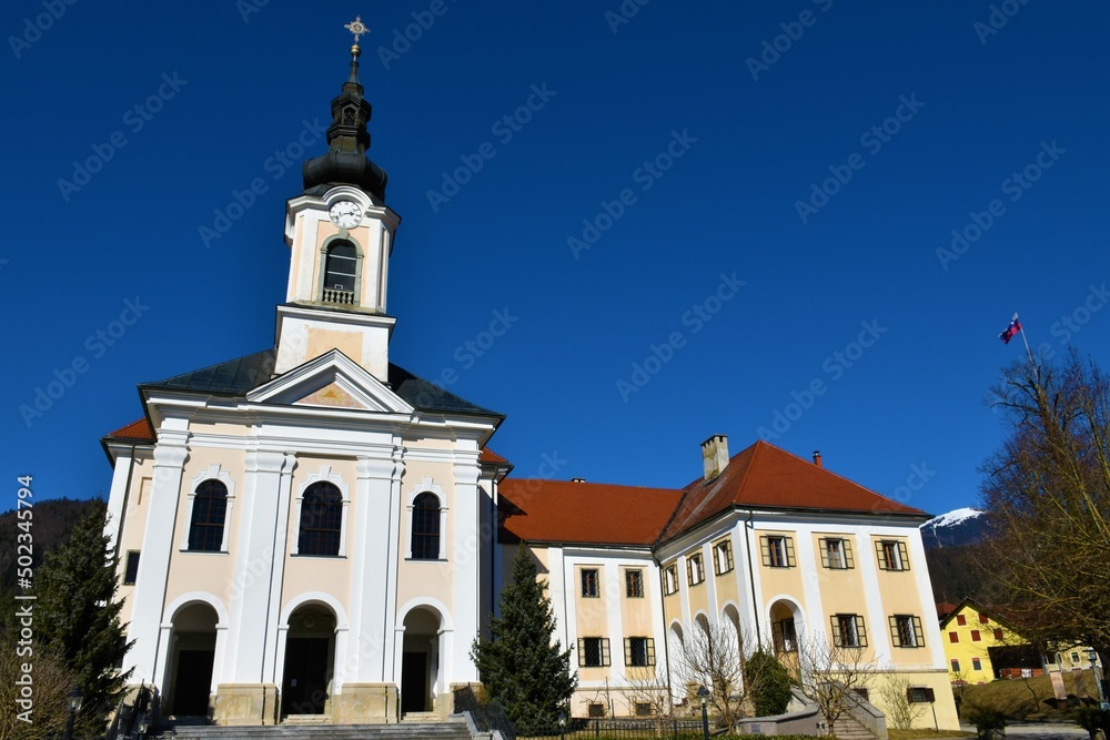 Church of the Assumption and Velesovo monastery in Adergas near Cerklje na Gorenjskem in Slovenia