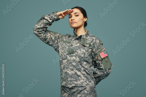United States servicewoman saluting in a studio photo