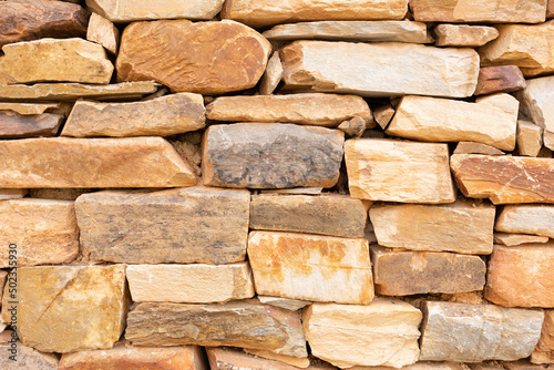 limestone wall of an old dwelling photo