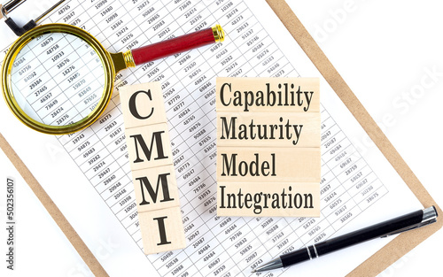 Paper with CMMI - Capability Maturity Model Integration a table on charts, business concept photo