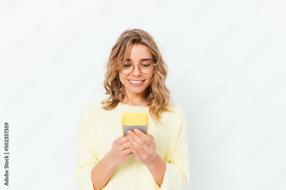 Satisfied smiling young blonde woman wearing glasses Satisfied smiling young blonde woman wearing glasses