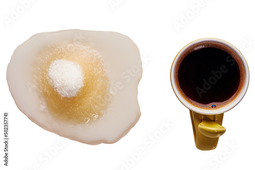 Sweet black coffee with milk, isolated. A small cup with an invigorating drink. photo