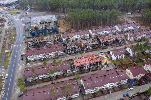 Top view of the destroyed and burnt houses. Houses were destroyed by rockets or mines from Russian soldiers. Cities of Ukraine after the Russian occupation. #502358387