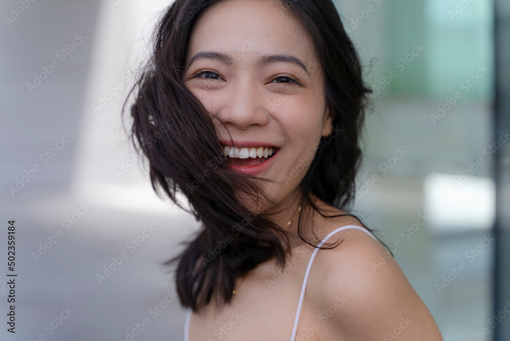 portrait of a charmng asian woman smile at camera