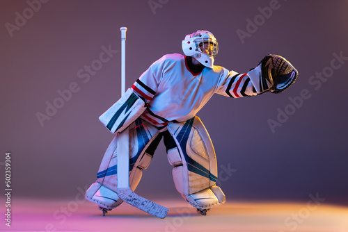 Canvas Print Portrait of young by, teen hockey player, goalkeepr training, catching puck isol