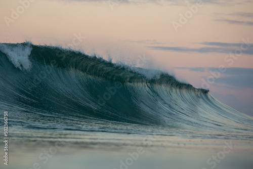 Wave breaking during pastel sky sunset  © Michael