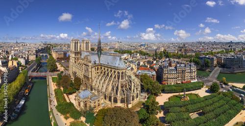 Panoramic aerial view of Notre Dame Basilica along the Seine river in Paris, France. photo