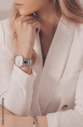 Stylish beautiful white watch on woman hand.