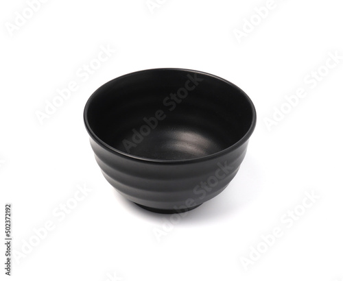 Black ceramic bowl isolated on white background.