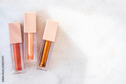 Three shades of trendy bronze lip gloss