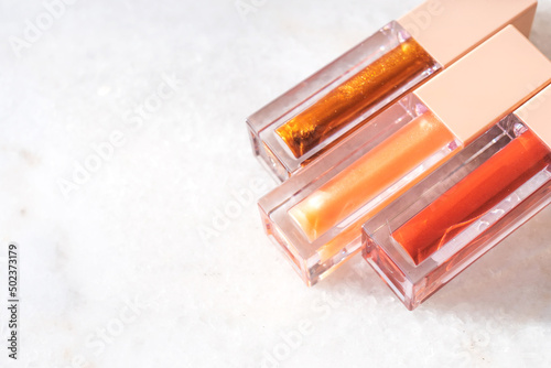 Three shades of trendy bronze lip gloss