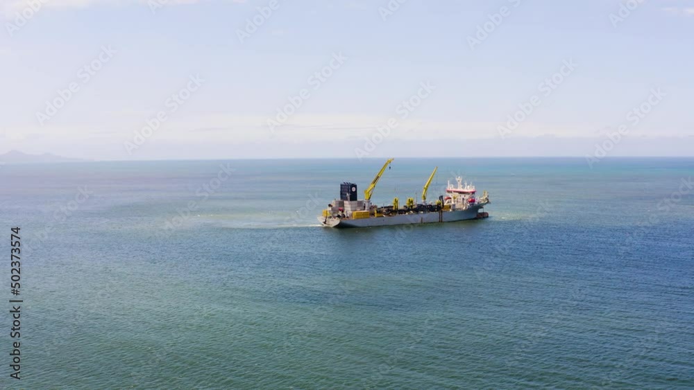 Aerial view of beach nourishment boat at the bay of Balneário Camboriú, Brazil. Aerial view of beach nourishment boat at the bay of Balneário Camboriú, Brazil.
