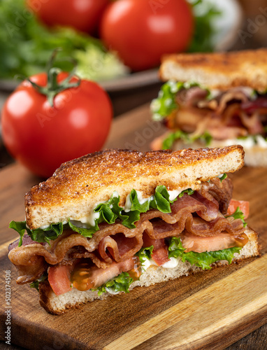 Bacon, lettuce and tomato sandwich cut in half