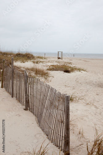 wooden fence on Sand Dunes at the ocean