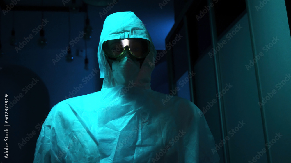 Close-up of mannequin in protective suit. Stock footage. Creepy eyes of mannequin are visible in protective glasses and mask. Equipment from virus or chemical attack on mannequin