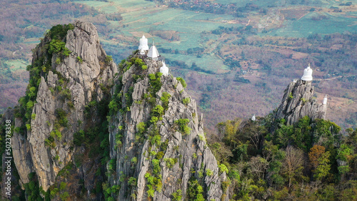 Aerial view of Wat Chaloem Phra Kiat Phrachomklao Rachanusorn, sky pagodas on top of mountain in Lampang Thailand photo