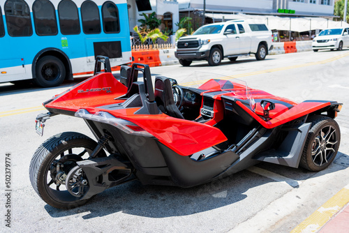 Photos Miami Beach, Florida USA - April 14, 2021: red polaris slingshot, back side view