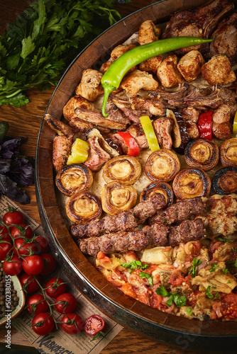 Assorted delicious grilled meat and bratwurst with vegetables