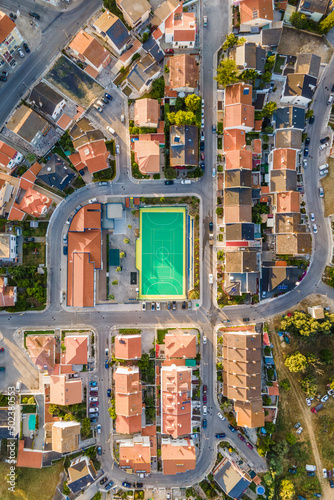 Aerial view of a football field in a residential district in Arrentela near Seixal, Setubal, Portugal. photo