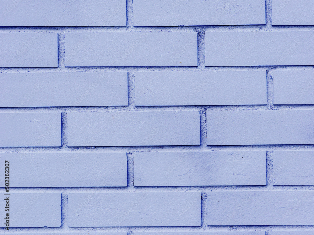 Obraz premium Blue brick wall with gray cement texture.