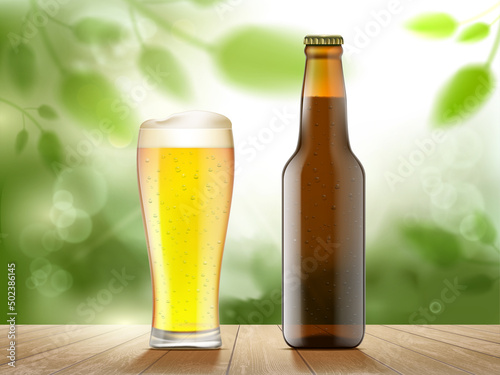 Glass of beer and a bottle on the background of nature.