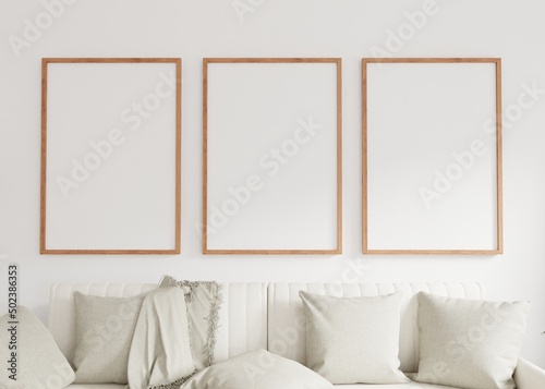 Three empty photo frame for mockup in living room. 3D rendering..